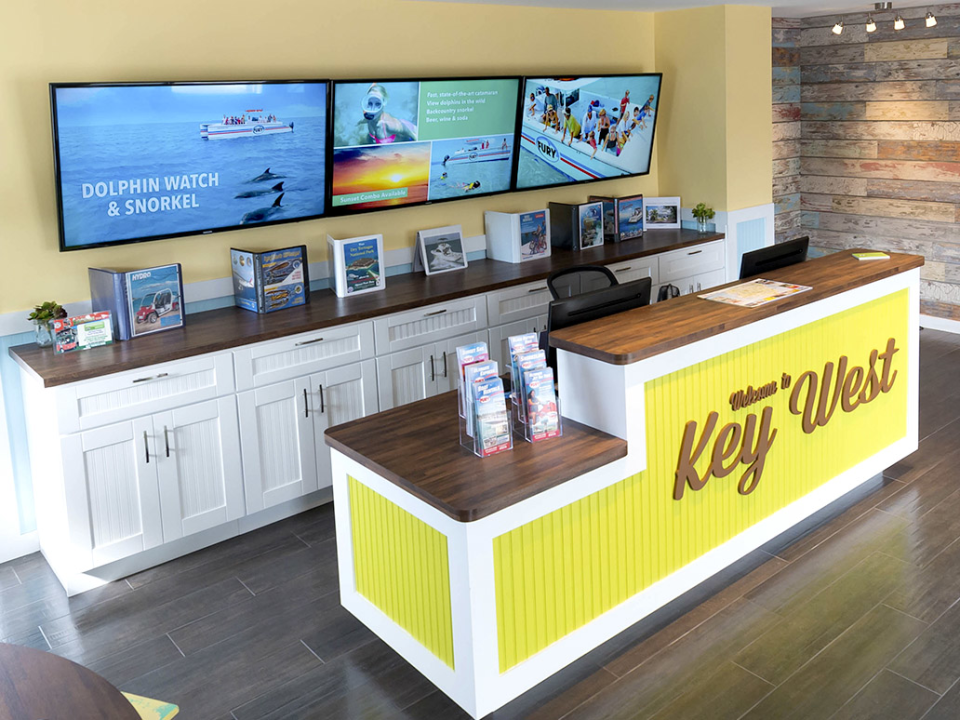 Arreya Software - A hospitality and tourism multi-screen video wall for ticketing counters. Digital signage such as this is possible because of the secure hardware Arreya offers, along with our incredible digital software full of templates, widgets, and other features.